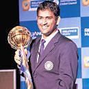 MS Dhoni displays the ICC Test Championship mace in  New Delhi on Sunday. AP