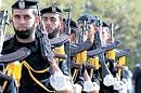 Armed Hamas men march during a ceremony marking the first anniversary of Israels offensive in Gaza on Sunday. AP