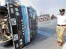 The police van attached to M Karunanidhis convoy, which turned upside down on Yeshwanthapura flyover in Bangalore on Sunday. DH  Photo