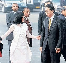Japanese Prime Minister Yukio Hatoyama and wife Miyuki Hatoyama arrive at the Air Force Station in Delhi on Monday. PTI