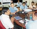 Deputy Commissioner V Ponnuraj holding discussion with  representatives of SMIT Singapore Private Limited in Mangalore on Tuesday. DH photo