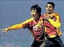 East Bengals Bhaichung Bhutia (left) and Mehtab Hussain celebrate their teams semifinal win over Mohun Bagan in the Federation Cup in Guwahati on Thursday. East Bengal won 2-0. PTI