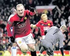 Wayne Rooney celebrates after scoring Manchester Uniteds first goal against Wigan at Old Trafford on Wednesday. AP