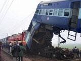 People near the site of accident after Bihar-bound Lichchavi Express rammed into the stationary Delhi-Islampur Magadh Express at Saraibhopat near Etawah on Saturday. PTI