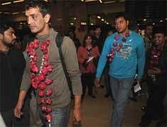 Indian boxers Parnoj Kumar (L) and Naresh Singh (R) leave the arrivals hall of Jinnah international Airport in Karachi on Dec 31, 2009. AFP