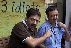 Writer Abhijat Joshi (L) and director Rajkumar Hirani of the movie '3 idiots' addressing a press conference over a row with novelist Chetan Bhagat in Mumbai on Saturday. PTI