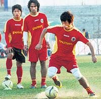 Steering the ship East Bengals Bhaichung Bhutia (right) touches up on his dribbling skills during a practice session.PTI