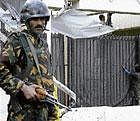 In this file photo, a Yemeni soldier guards the main entrance of the US Embassy in the capital Sanaa. AP