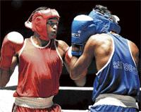 Take that! Raj Kumar of Karnataka A (left) en route to his win over Rajesh of Andhra Pradesh  in the 54kg category of the South Zone boxing championship on Sunday. DH photo