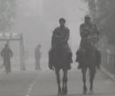 BSF jawans patrol at Attari-Wagah border,45 kilometres from Amritsar on a foggy Sunday. PTI Photo