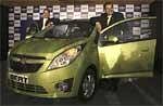 General Motors India Vice President P. Balendran, right, stands next to a Chevrolet Beat during it launch in Mumbai on Monday. AP