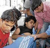 PES Engineering College student Tushar Singh, who was stabbed by a group of miscreants being rushed to  hospital in Mandya on Monday. DH photo