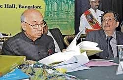 Governor H R Bhardwaj releasing books on Vijayanagara Empire in Bangalore on Monday.  dh photo