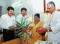 Deputy Commissioner V Ponnuraj and Deputy Mayor Rajani Dugganna inaugurating a workshop on solid waste management by watering a plant in Mangalore on Tuesday. dh photo