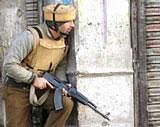 On high alert : Central Reserve Police Force personnel keep vigil during an encounter  in Srinagar on Wednesday. AFP