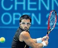 On the ball: Serbias Janko Tipsarevic en route to his win over Indias Somdev Devvarman in the second round of the Chennai Open on Wednesday. AFP