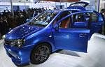 Photo Go to Article  Onlookers stand next to Toyota's compact car 'Etios' at the 10th Auto Expo in New Delhi . Reuters