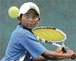 Eyes on the ball: Arjun Muralidhar on his way to an upset win over Mohit Reddy in Bangalore on Thursday. DH photo