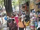 Footpaths vanish, garbage piles up