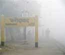 Heavy fog engulfs the Faridabad railway station on Thursday morning. PTI