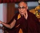 Tibetan spiritual leader The Dalai Lama gestures during the fourth day of a teaching session at The Kalachakra Ground near The Mahabodhi Temple in Bodhgaya on Friday. AFP