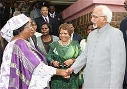 Vice President of India M Hamid Ansari shakes hands with his Republic of Malawi counter-part Joyce Banda after visiting the government offices, in Lilongwe on Thursday. PTI