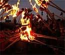 Members of the United Front of Communist Party of Nepal participate in a torch rally in Katmandu, Nepal on  Saturday,  AP