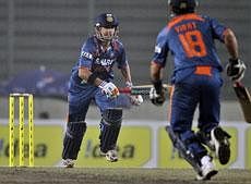 India's Gautam Gambhir, left, and Virat Kohli run between the wickets during the fifth one-day international cricket match against Sri Lanka of the tri-series in Dhaka (AP)