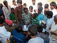 Disabled persons enquiring about aiding equipment at Koppa Town Panchayat stadium on Sunday. DH Photo