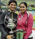 double delight National champion Chetan Anand with his wife Jwala Gutta, who claimed the womens doubles and mixed doubles crowns, in Guwahati on Sunday. pti