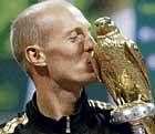 CHAMP Davydenko kisses the Qatar Open trophy. REUTERS