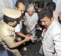 Two Feet Below: Officials help former President Dr A P J Abdul Kalam step out of the lift which sank two feet deep due to overcrowding, during the inauguration of Indus Westside Hospital at Jananbharti Layout in Bangalore on Sunday. DH Photo