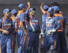 Indian players celebrate the dismissal of Bangladesh's Imrul Kayes during the sixth ODI match of the tri-series in Dhaka on Monday. AP