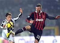 AC Milan's David Beckham (right) in action with Juventus' Claudio Marchisio, during the Serie A soccer match at the Olympic Stadium in Turin on Sunday. AP