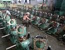 Technicians work on engines used for water pumps inside a manufacturing unit in Rajkot. File photo/Reuters