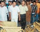 District-in-Charge Minister J Krishna Palemar visiting stalls at the Karavali-Pilikula expo at Karavali Utsav Grounds in Mangalore on Tuesday.
