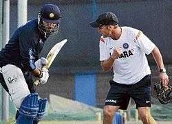 Guru garY: Coach Gary Kirsten gives batting tips to Yuvraj Singh on the eve of Wednesdays tri-series final against Sri Lanka in Dhaka. AFP