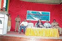 SP Manjunath Annigeri speaking at the valedictory of Crime Prevention Month and Road Safety Week in Madikeri on Wednesday. DH Photo