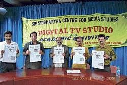 Deputy Commissioner Somashekhar releasing a college journal Siddharata Sampada at the Siddharta Centre for Media Studies in Tumkur on Wednesday. DH Photo