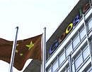 A Chinese national flag flies in front of the Google China headquarters in Beijing on Wednesday. Reuters