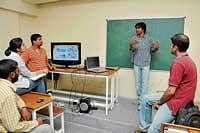 Rabi explaining the process of film-making to the students.