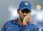 Bitter Defeat: Indian captain M S Dhoni struggles to hide his disappointment after the final on Wednesday.  AFP