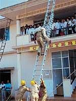 A rescue operation being demonstrated during the National Disaster Reduction Day at KSHEMA in Derlakatte onWednesday.