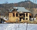 collateral damage: A view of the  house where militants were hiding during the encounter with the security forces at Khazanbal in Kulgam, about 110 km from Srinagar on  Thursday. PTI