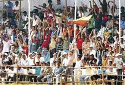 in high spirits: Spectators poured in by the numbers for the Ranji Trophy final between Karnataka and Mumbai, justifying the decision to shift the tie to Mysore. dh photo/ srikanta sharma r