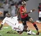 strong challenge Malawis Jimmy Zakazaka (left) tackles Angolas Mabina during their African Nations Cup match in Luanda on Thursday. ap