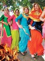 Women dancing around a bonfire in Punjab.