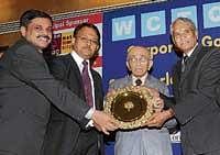 Medical Education Minister Ramachandra Gowda  presenting Golden Peacock Award for Leadership 2010 to KSRTC MD Gaurav Gupta (second from left) and Director MA Saleem at 20th IOD Convention in Bangalore on Saturday. Former Chief Justice P N Bhagwati (centre) is also seen. dh photo