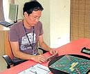 Crossing words: Thai national Pakorn Namitramansuk is all  concentration during a game.