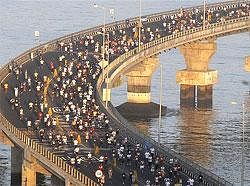 Mumbai Marathon participants run through the newly-built sea bridge linking Mumbai to its far-flung suburbs in Mumbai on Sunday. AP